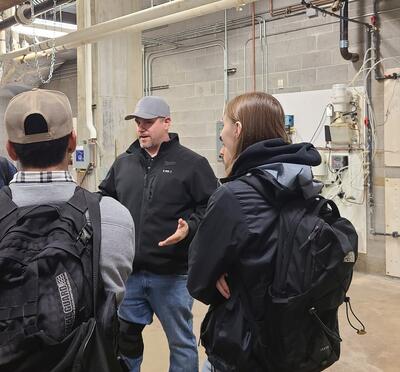 Justin Fuszek speaking to a group of students
