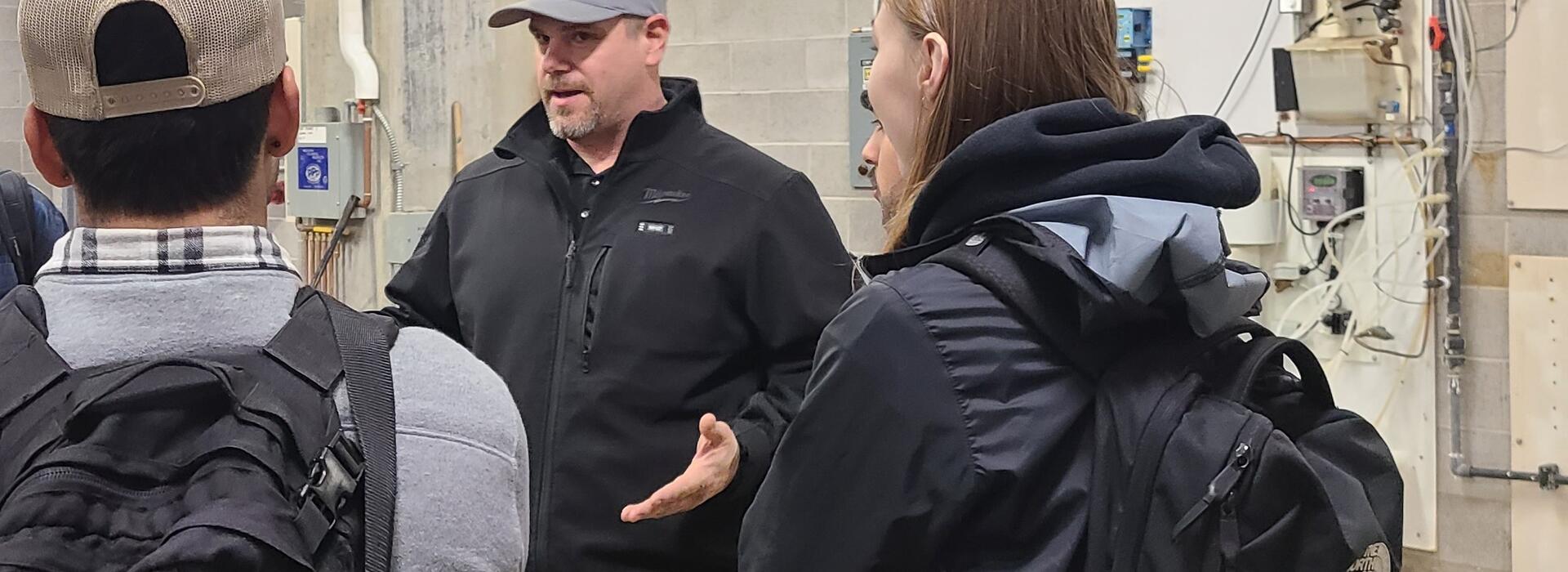 Justin Fuszek speaking to a group of students